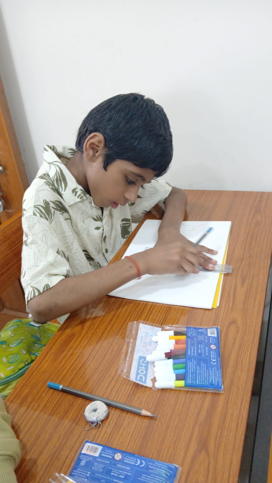 Young girl coloring a drawing at Art Therapy Workshop, Smart Kids Study Circle