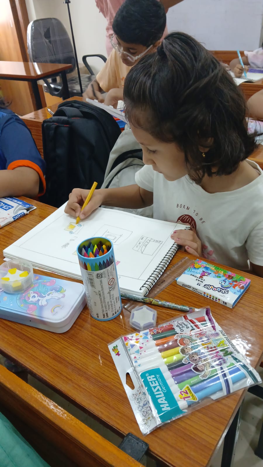 Student coloring a nature drawing at art therapy session, Smart Kids Study Circle