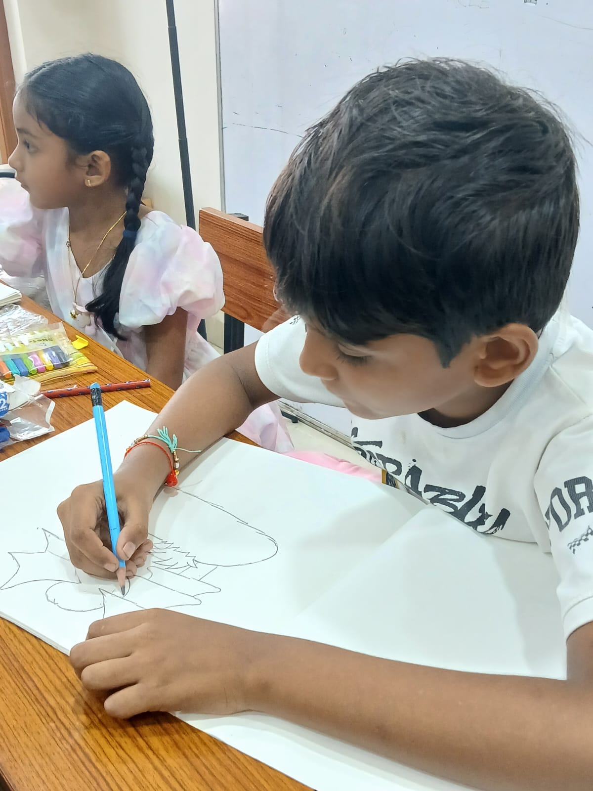Student sketching at art therapy session Smart Kids Study Circle Nagpur